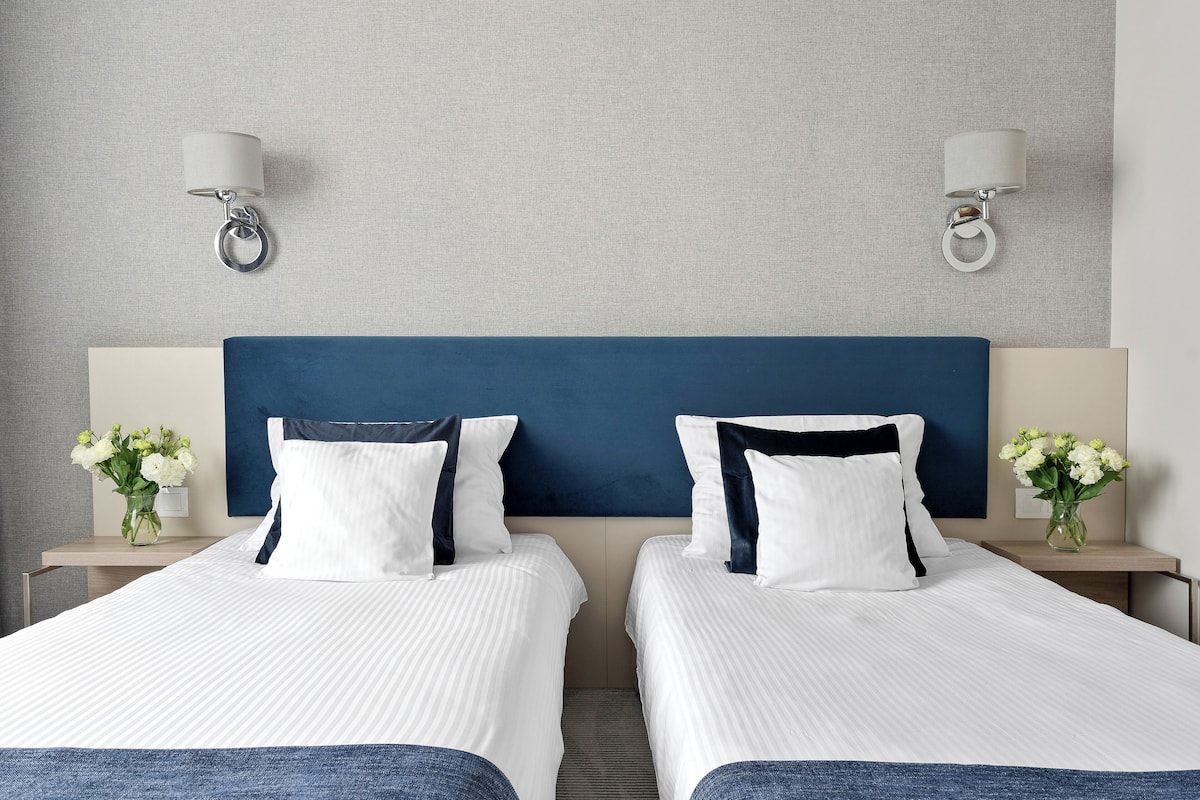 comfort twin room | premium bedding, desk, soundproofing, iron/ironing board