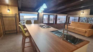 Panoramic Loft, 1 Bedroom | Living area | 32-inch flat-screen TV with satellite channels, TV