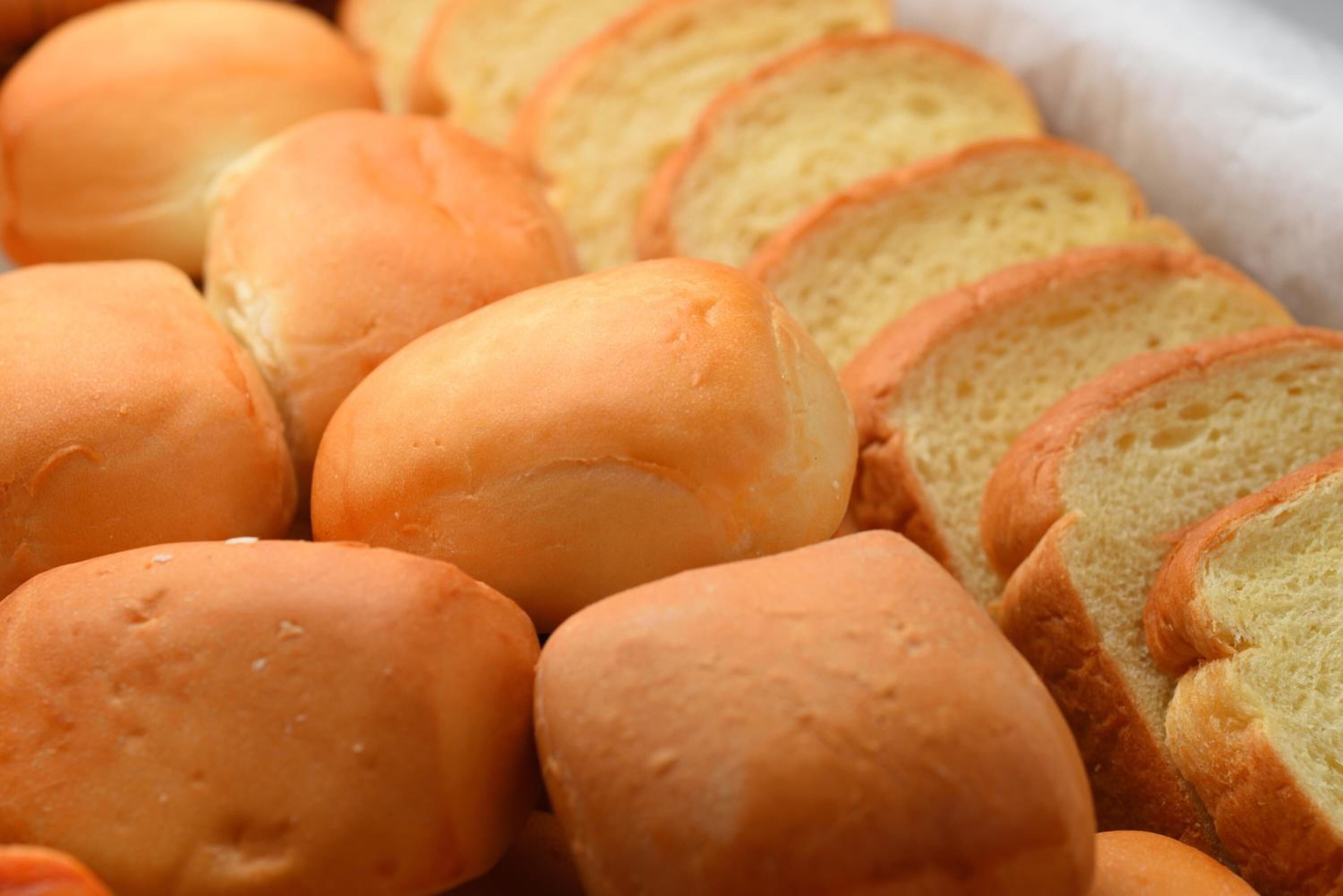 A tray of freshly baked bread rolls.