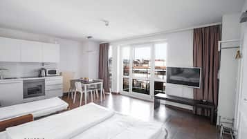 Apartemen Standar, 1 Tempat Tidur Queen dengan tempat tidur Sofa | Dapur pribadi | Lemari es, microwave (berdasarkan permintaan), oven, dan kompor