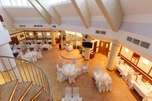 Enjoy dining in this elegant space with high ceilings and a central stage.