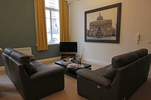 City Apartment, 2 Bedrooms | Living room | 50-inch flat-screen TV with cable channels, TV