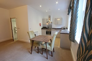 City Apartment, 1 Bedroom | Living area | 50-inch flat-screen TV with cable channels, TV