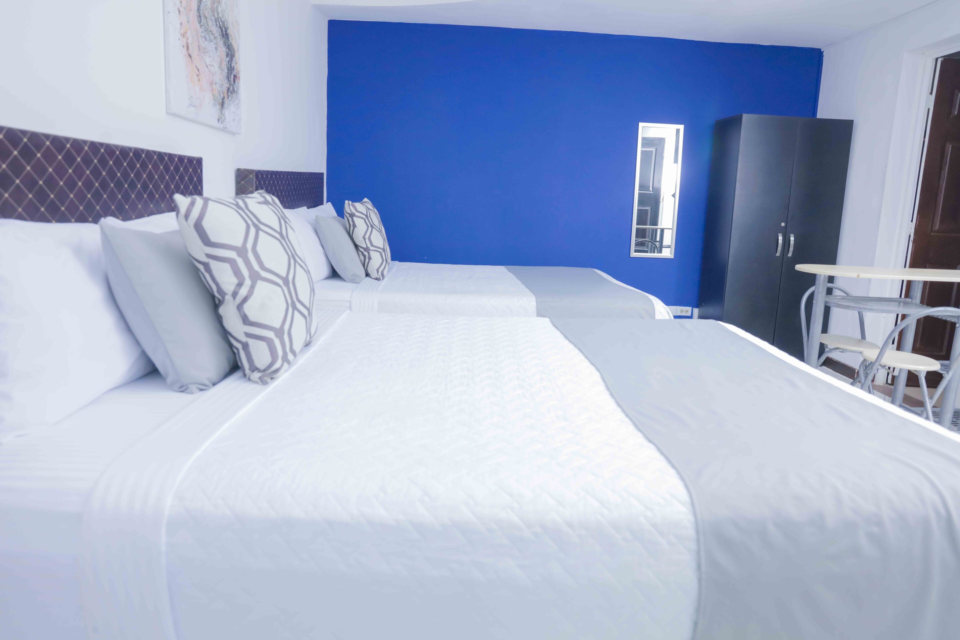 Deluxe Quadruple Room, 2 Queen Beds, Private Bathroom, Courtyard View | Premium bedding, free WiFi, bed sheets