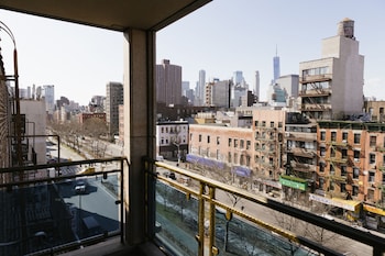 Balcony King Deluxe Room | In-room safe, desk, blackout drapes, iron/ironing board at The Allen Hotel