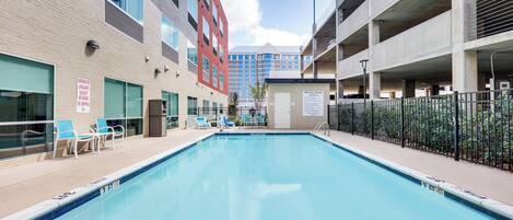 Outdoor pool, open 10:00 AM to 10:00 PM, sun loungers