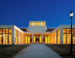 A building with a large entrance, columns, and a sign reading 'George W. Bush Presidential Library and Museum.'