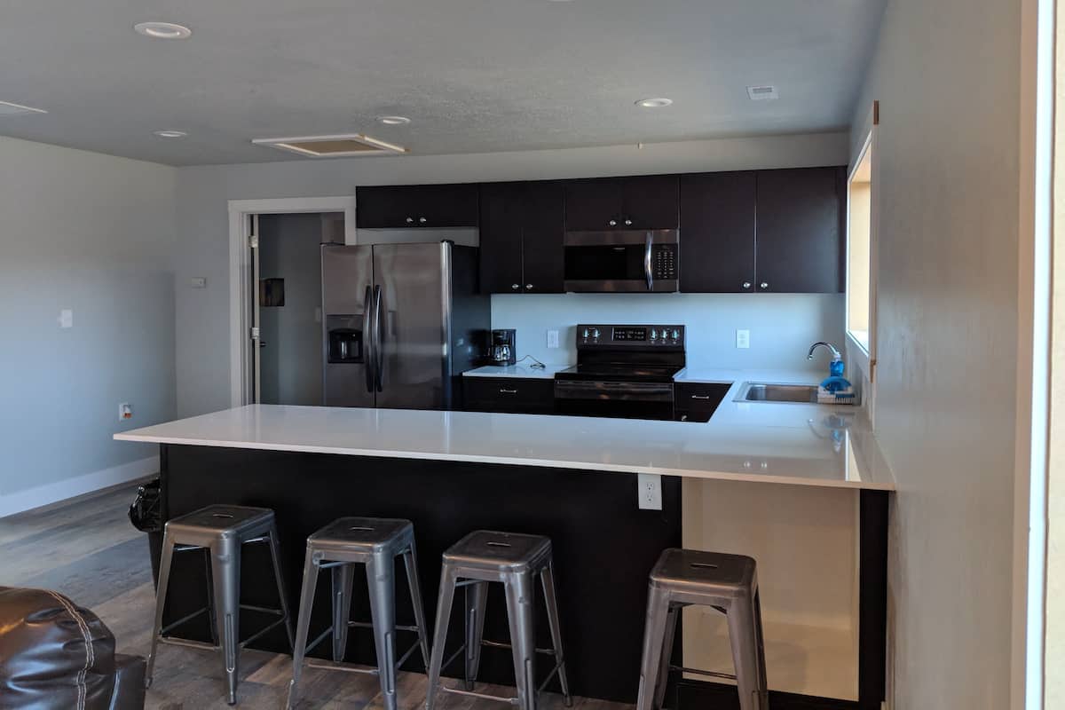 Deluxe Condo, 2 Bedrooms | Private kitchenette | Fridge, microwave, coffee/tea maker
