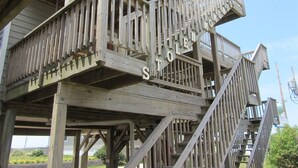A wooden structure with a staircase and a sign that reads "STOLEN MOON".