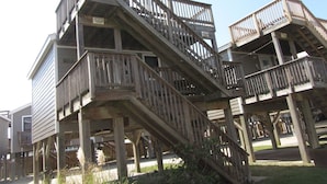 A multi-level wooden structure with balconies and staircases.