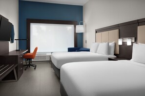 Luxe beddengoed, een kluis op de kamer, een bureau, een laptopwerkplek
