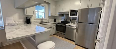 Cottage, 4 Bedrooms | Private kitchen | Full-size fridge, microwave, stovetop, dishwasher