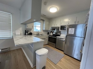 Cottage, 4 Bedrooms | Private kitchen | Coffee/tea maker, full-size fridge, microwave, stovetop