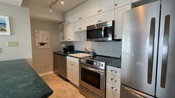 Condo, 1 Bedroom | Private kitchen | Full-size fridge, microwave, stovetop, dishwasher