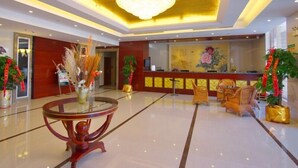 A hotel lobby with a reception desk, a chandelier, and a polished floor. - GreenTree Inn ChangZhou East DongFang Road HengNai Logistics Park Express Hotel (Changzhou)