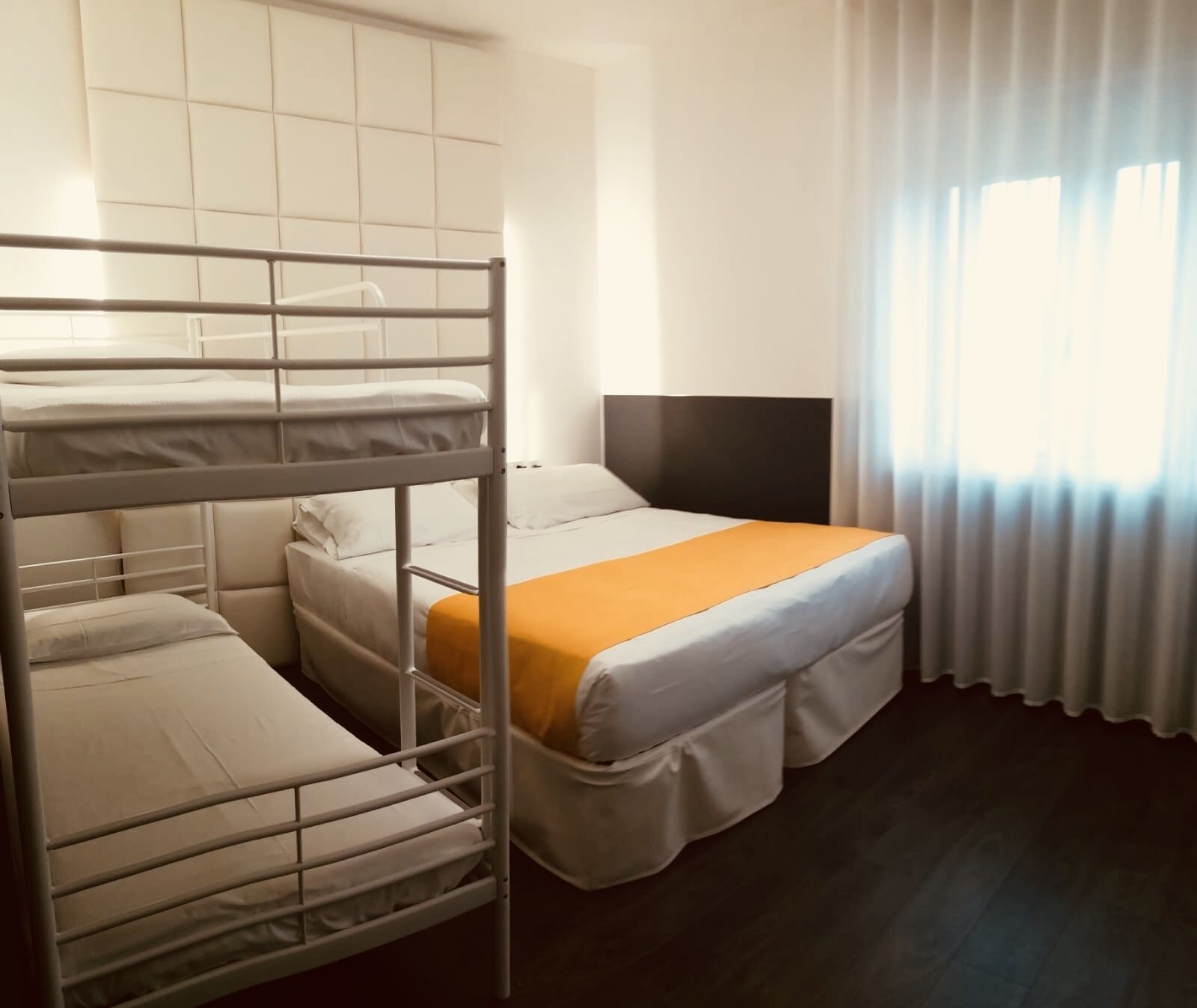 family room | premium bedding, minibar, in-room safe, desk