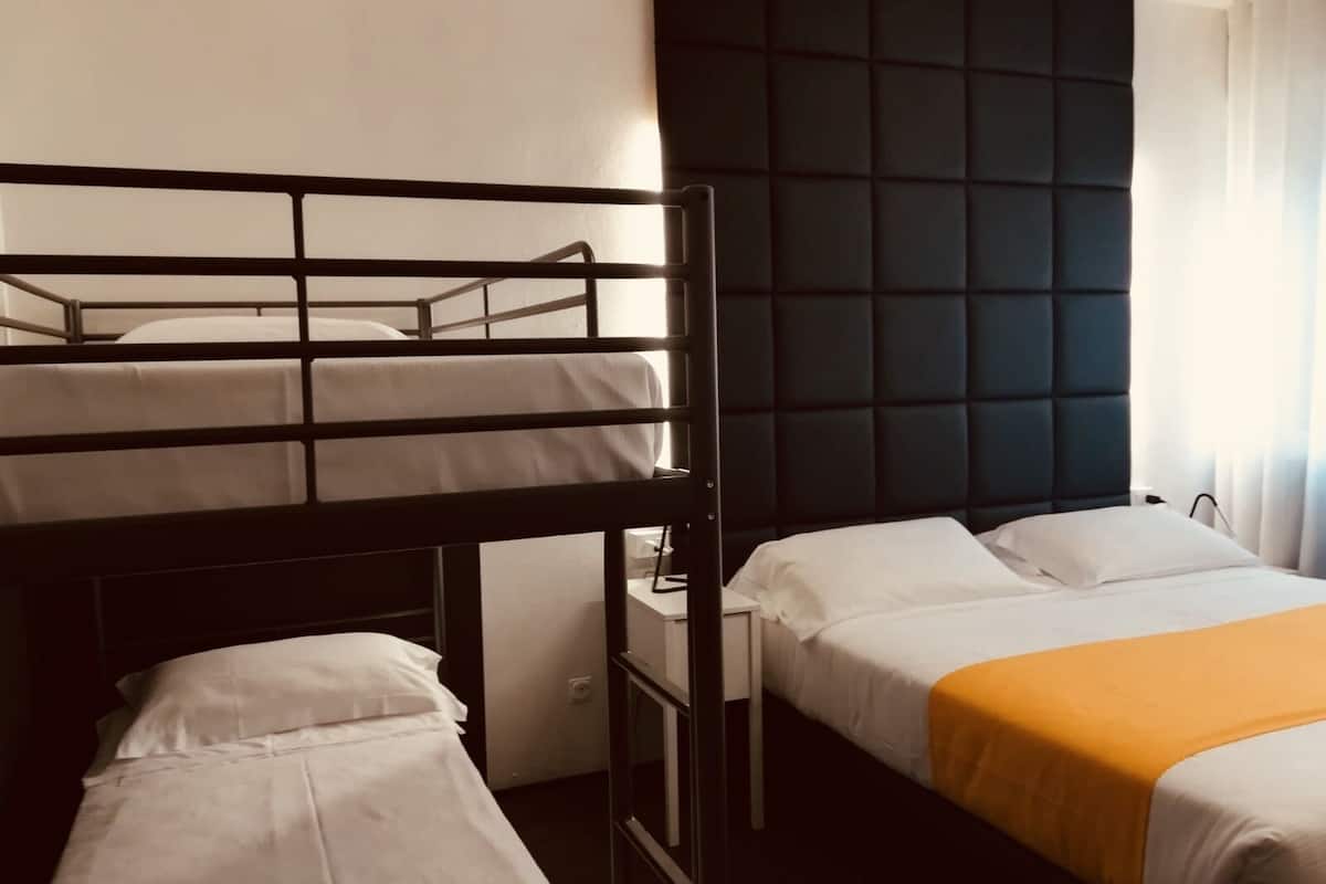 family room | premium bedding, minibar, in-room safe, desk