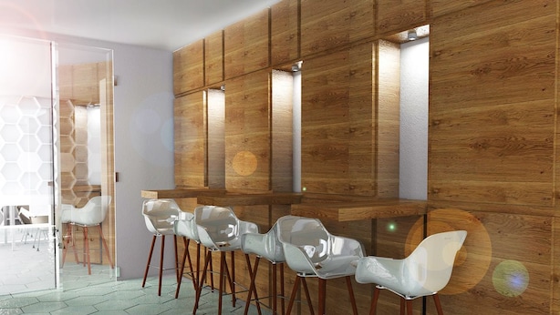 A modern interior with wooden panel walls, a bar area with stools, and a glass partition. - Hotel Pex (Rubano)