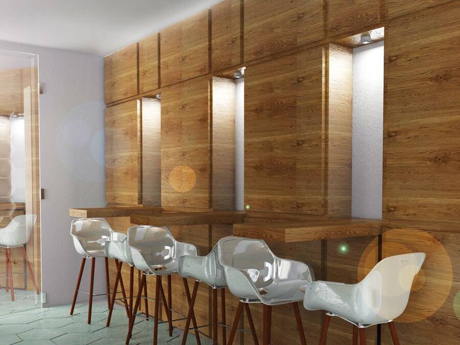 A modern interior with wooden panel walls, a bar area with stools, and a glass partition.