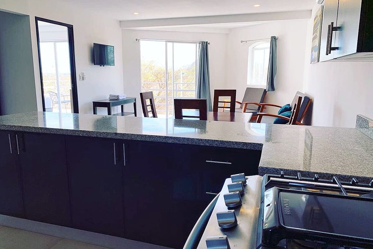 Family Condo | Private kitchen | Full-size fridge, microwave, oven, stovetop