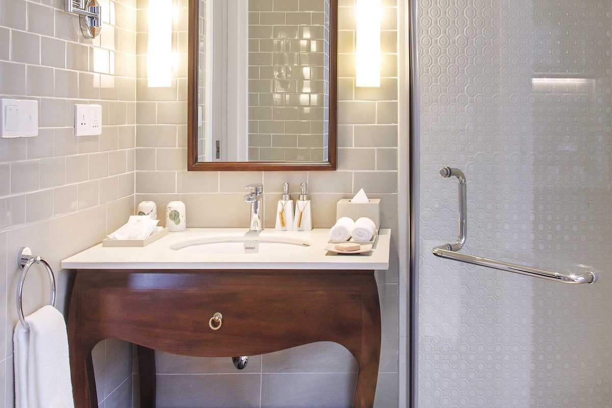 shower, rainfall showerhead, designer toiletries, hair dryer