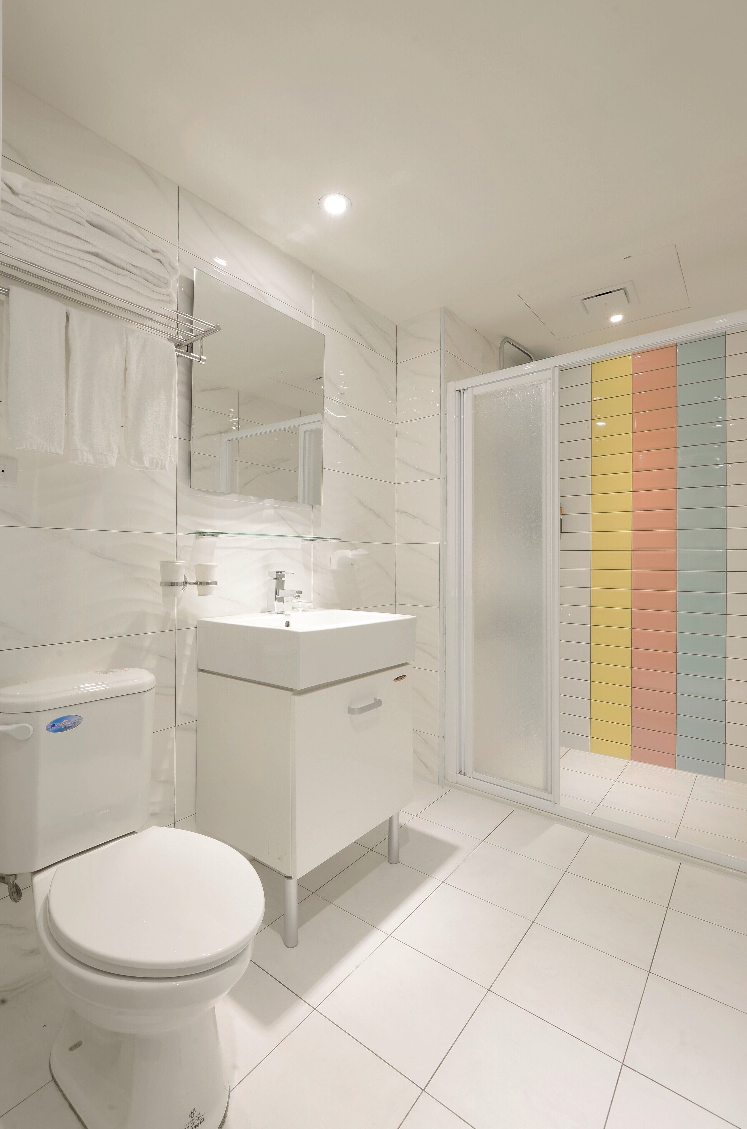 deluxe triple room, multiple beds | bathroom | free toiletries, hair dryer, slippers, towels