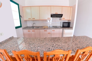 Full-sized fridge, microwave, stovetop, electric kettle
