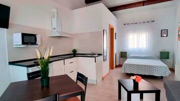 Superior Studio, 1 Bedroom | Living area | Flat-screen TV