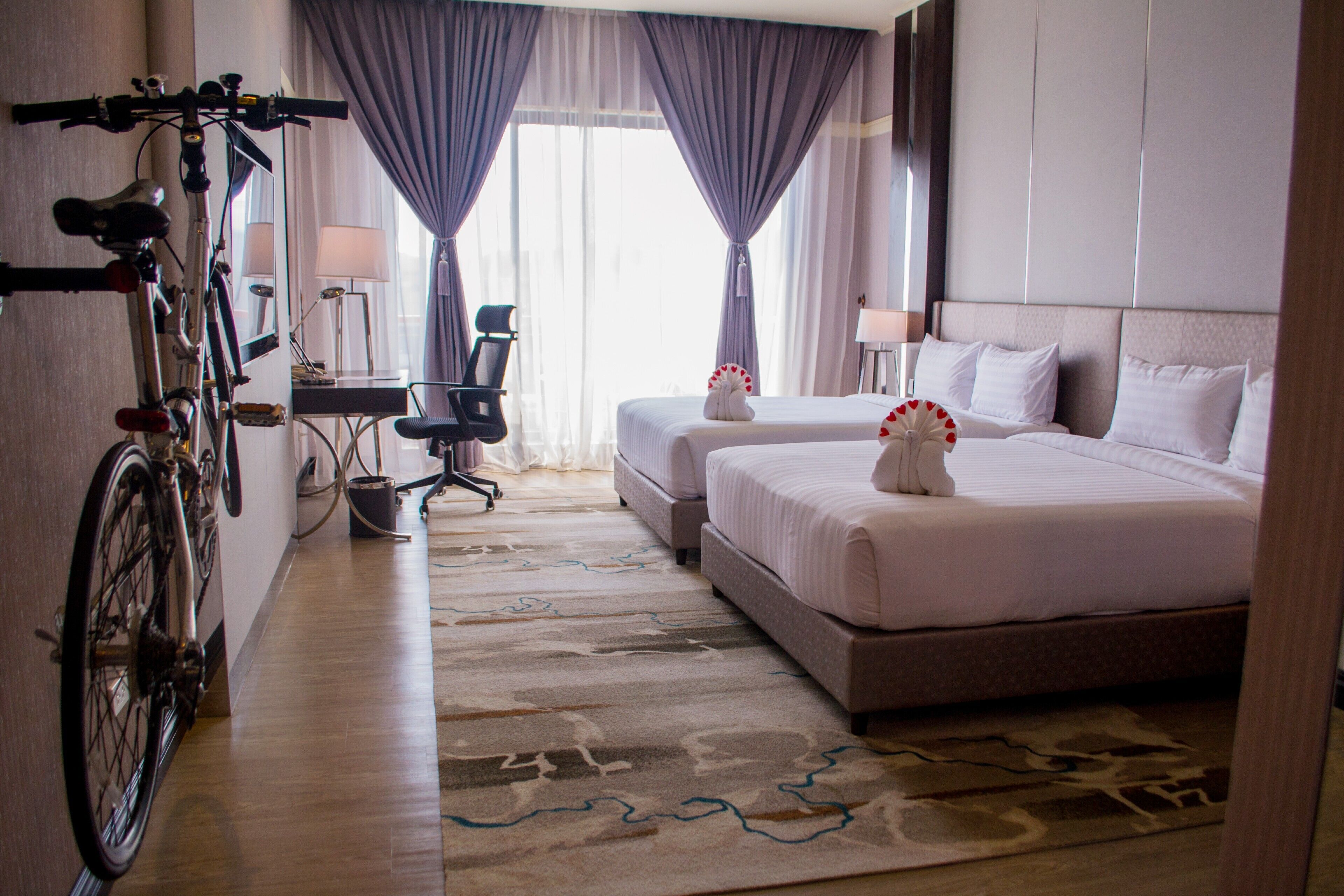 deluxe room, 2 queen beds, non smoking | minibar, in-room safe, desk, laptop workspace