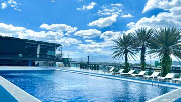 Outdoor pool, open 8:00 AM to 8 PM, pool loungers