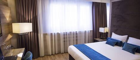 Suite Junior | Literie de qualité, minibar, coffre-fort, système d’insonorisation