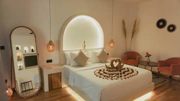 Deluxe Room, Pool View | Premium bedding, minibar, in-room safe, desk