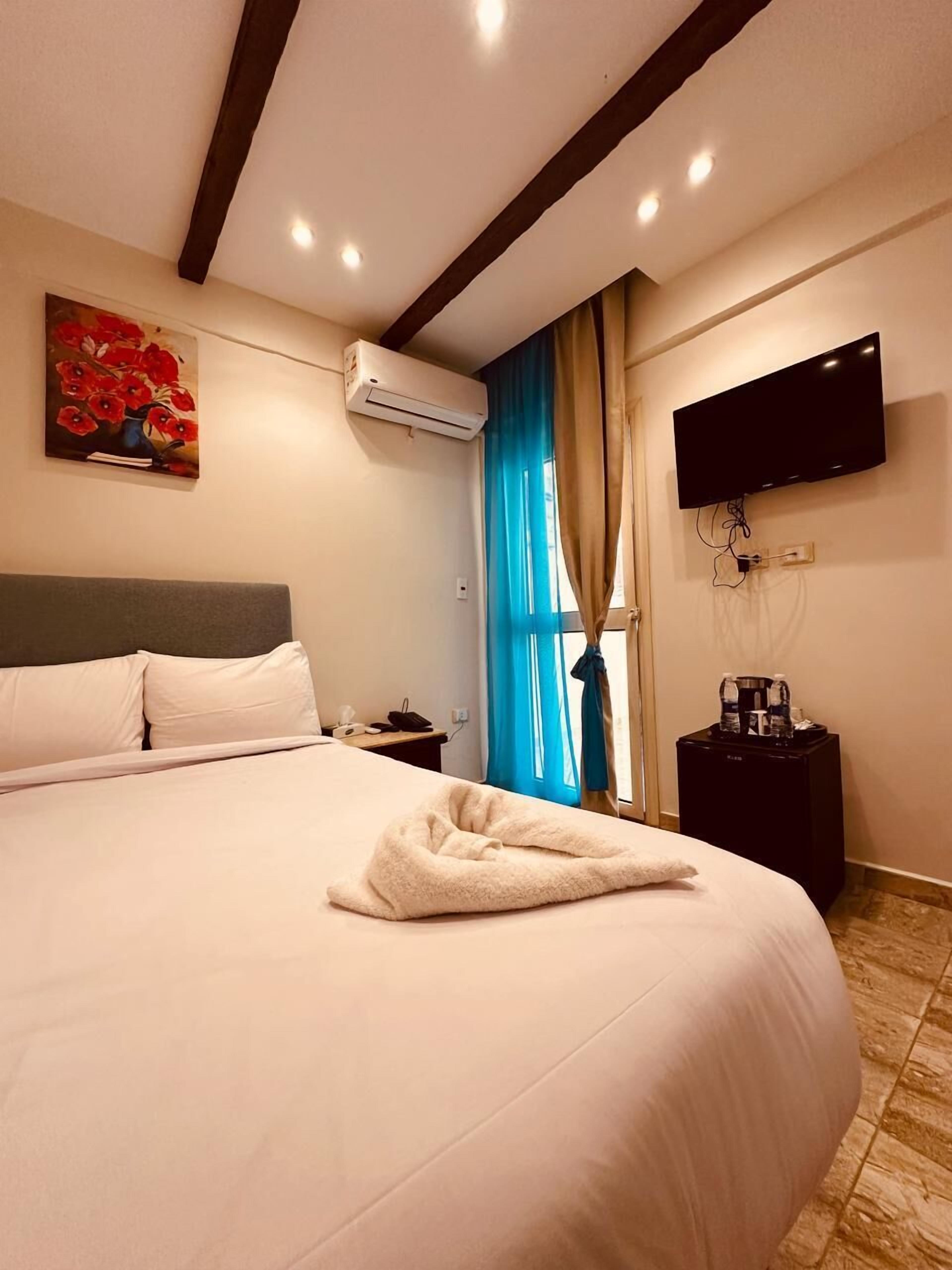 Sábanas de algodón egipcio, ropa de cama de alta calidad y minibar 