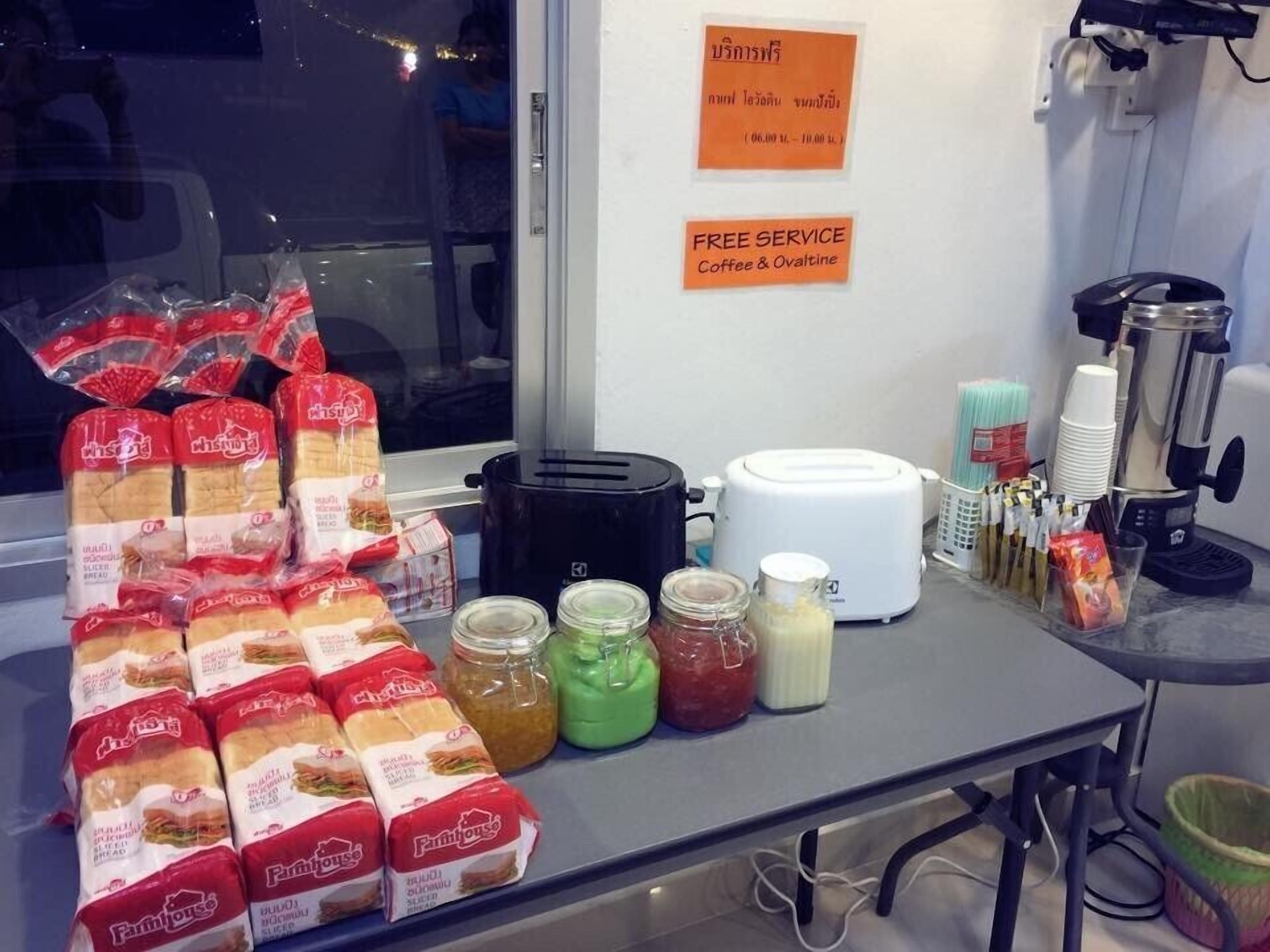 A kitchen area with packaged food items, a toaster, and a coffee machine.