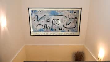 A framed artwork on a wall with the name "Paul Klee Insula Dulcamara" below it.