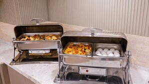 A buffet setup with various food items and a brand name visible. - Hotel Kayalar (Antalya)