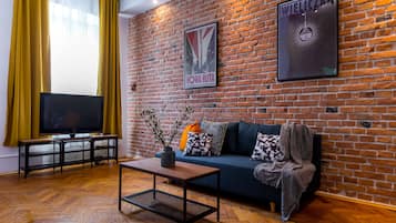 Exclusieve penthouse | Woonkamer | Een flatscreentelevisie