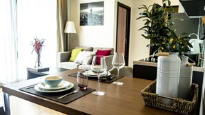 Enjoy a romantic dinner for two in this stylish dining area, complete with a comfortable sofa and city views.