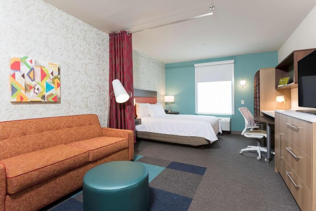 Desk, iron/ironing board, bed sheets