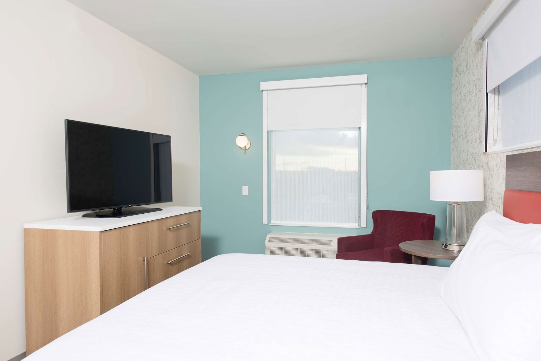 Desk, iron/ironing board, bed sheets