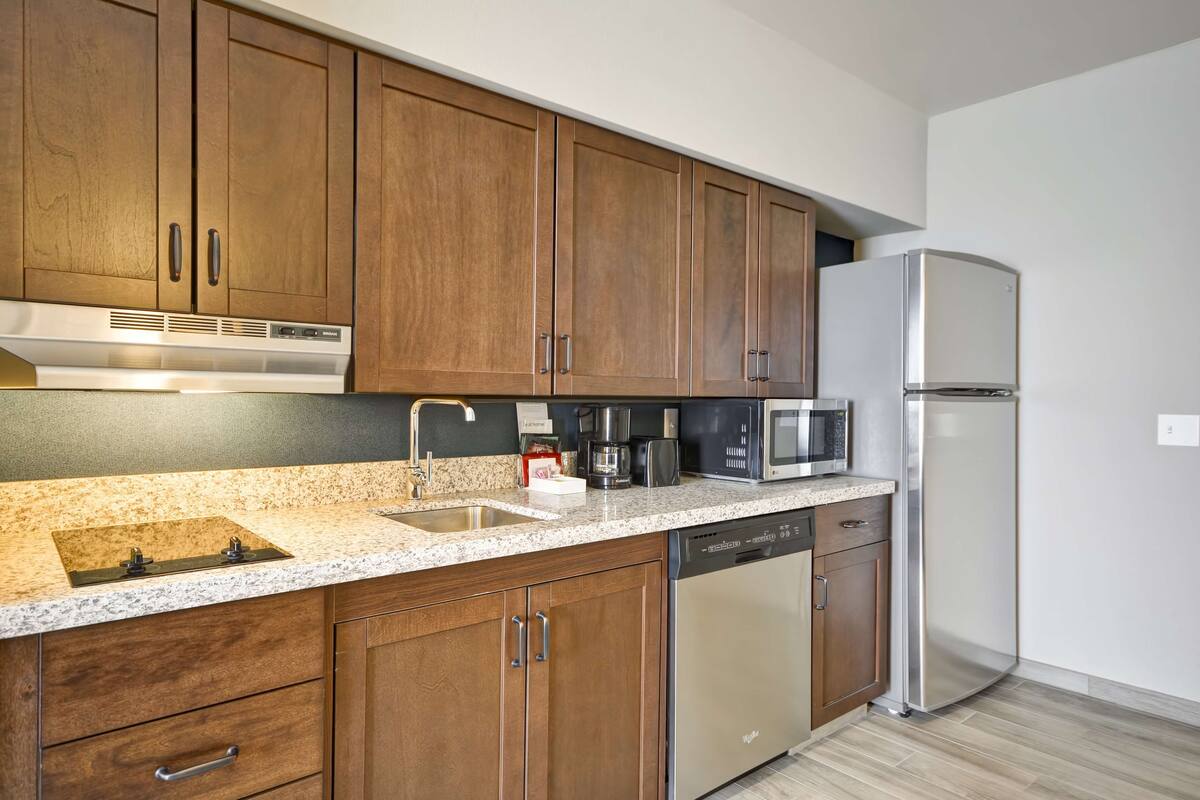 full-sized fridge, microwave, stovetop, dishwasher