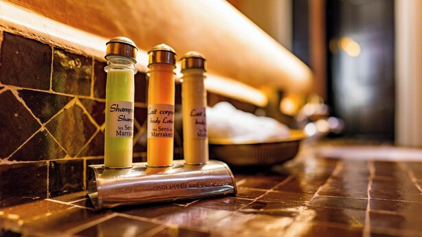 Three bottles of shampoo on a tiled counter. - Riad Dar Dialkoum (Marrakech)