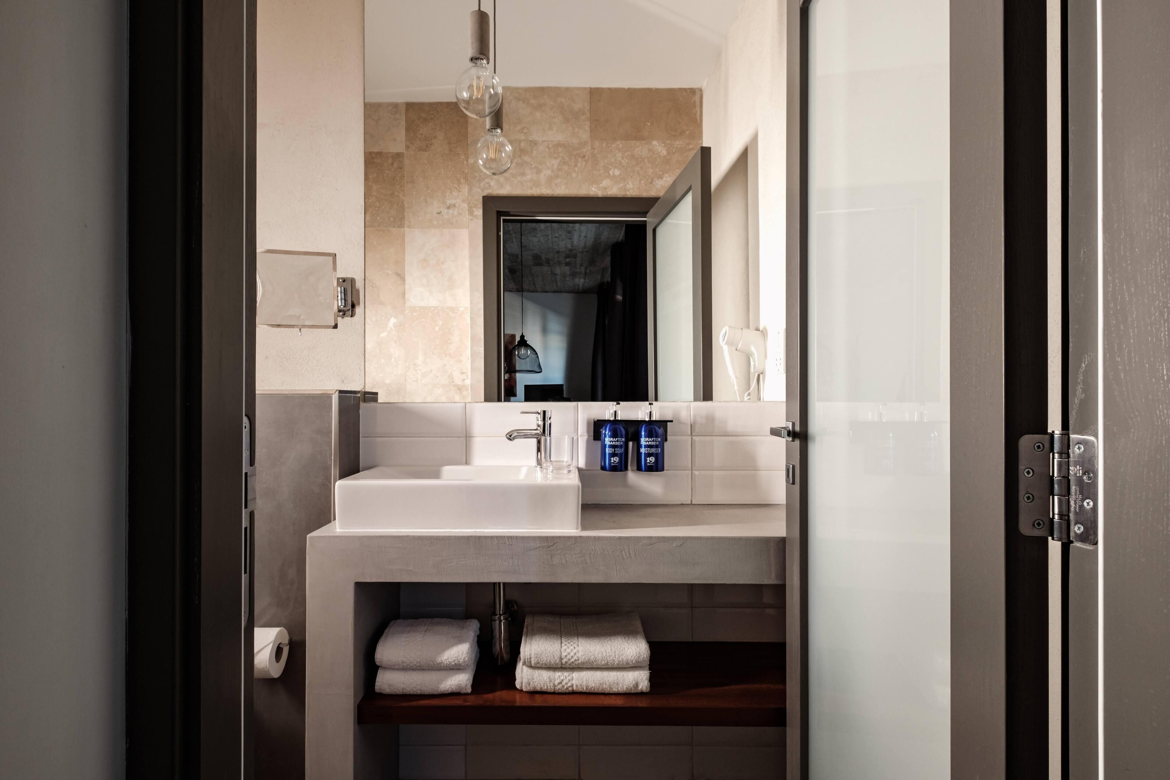 superior double room | bathroom | hair dryer, towels