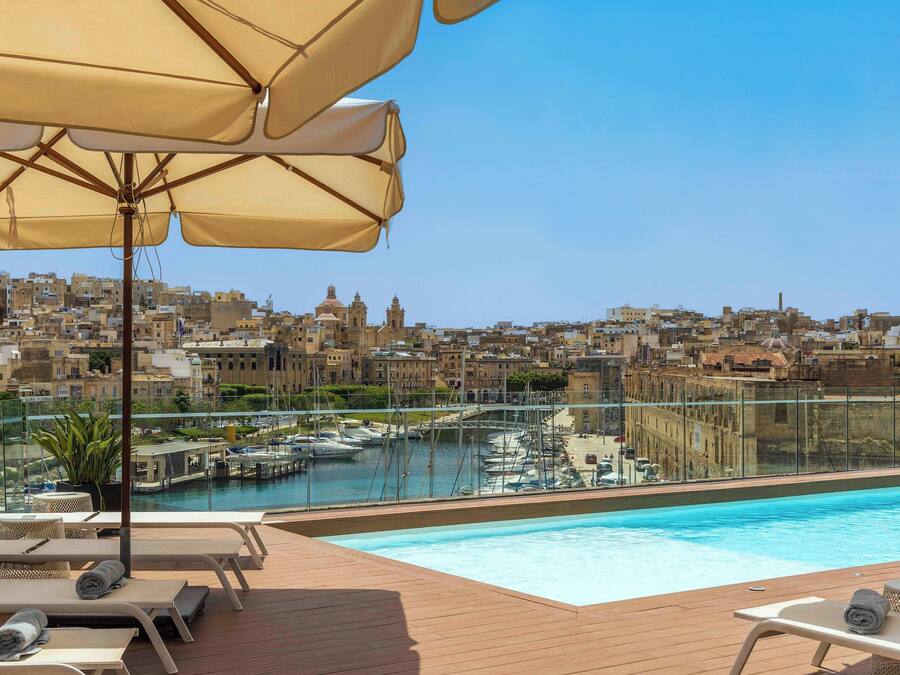 Seasonal outdoor pool, open 8:00 AM to 8:00 PM, pool umbrellas