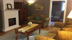 Cottage, 2 Bedrooms, Garden Area | Living room | Flat-screen TV, fireplace - Sunnyside Niagara Cottage (Niagara-on-the-Lake)