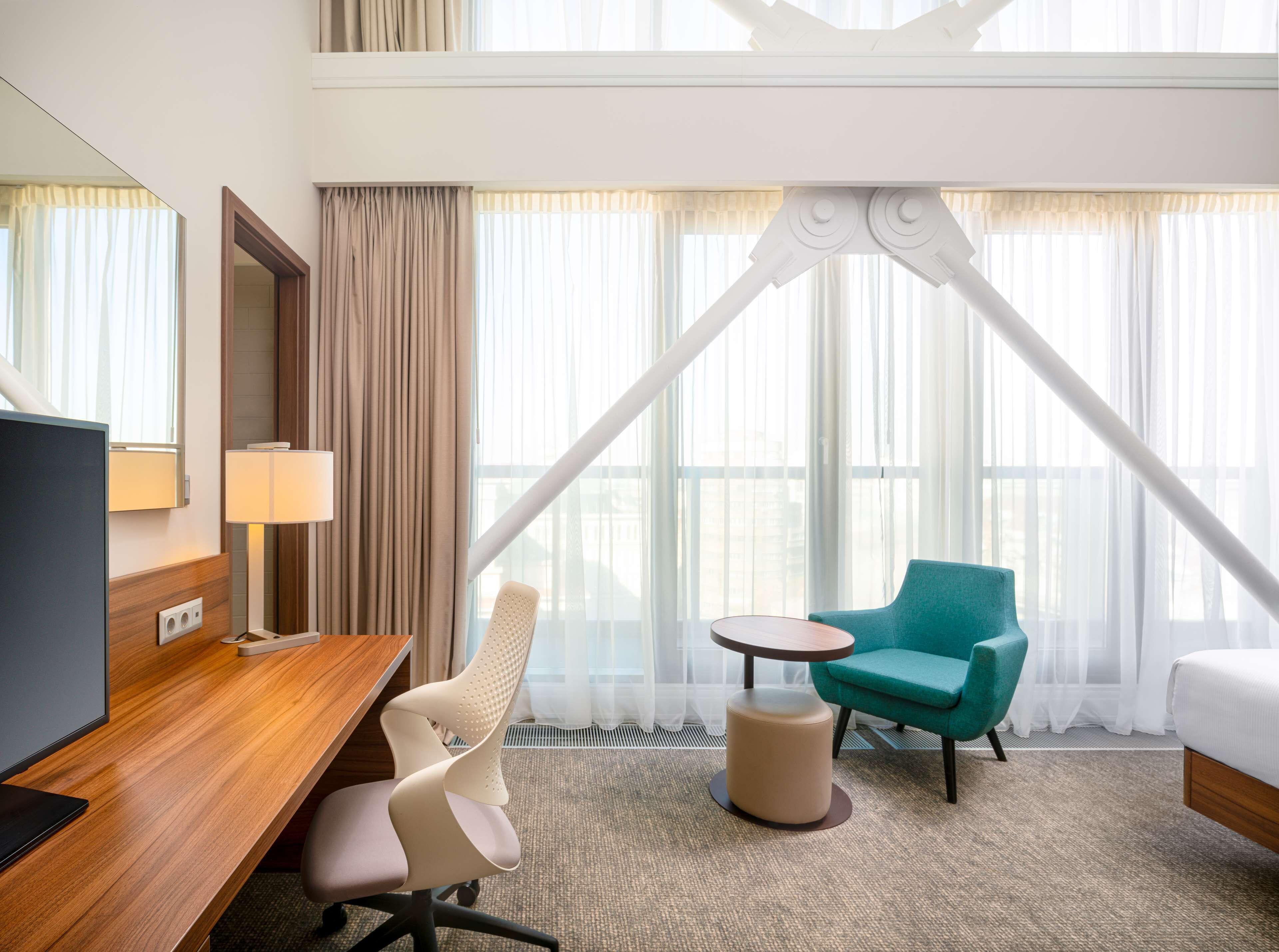 deluxe room, 1 king bed, city view | in-room safe, desk, laptop workspace, blackout curtains