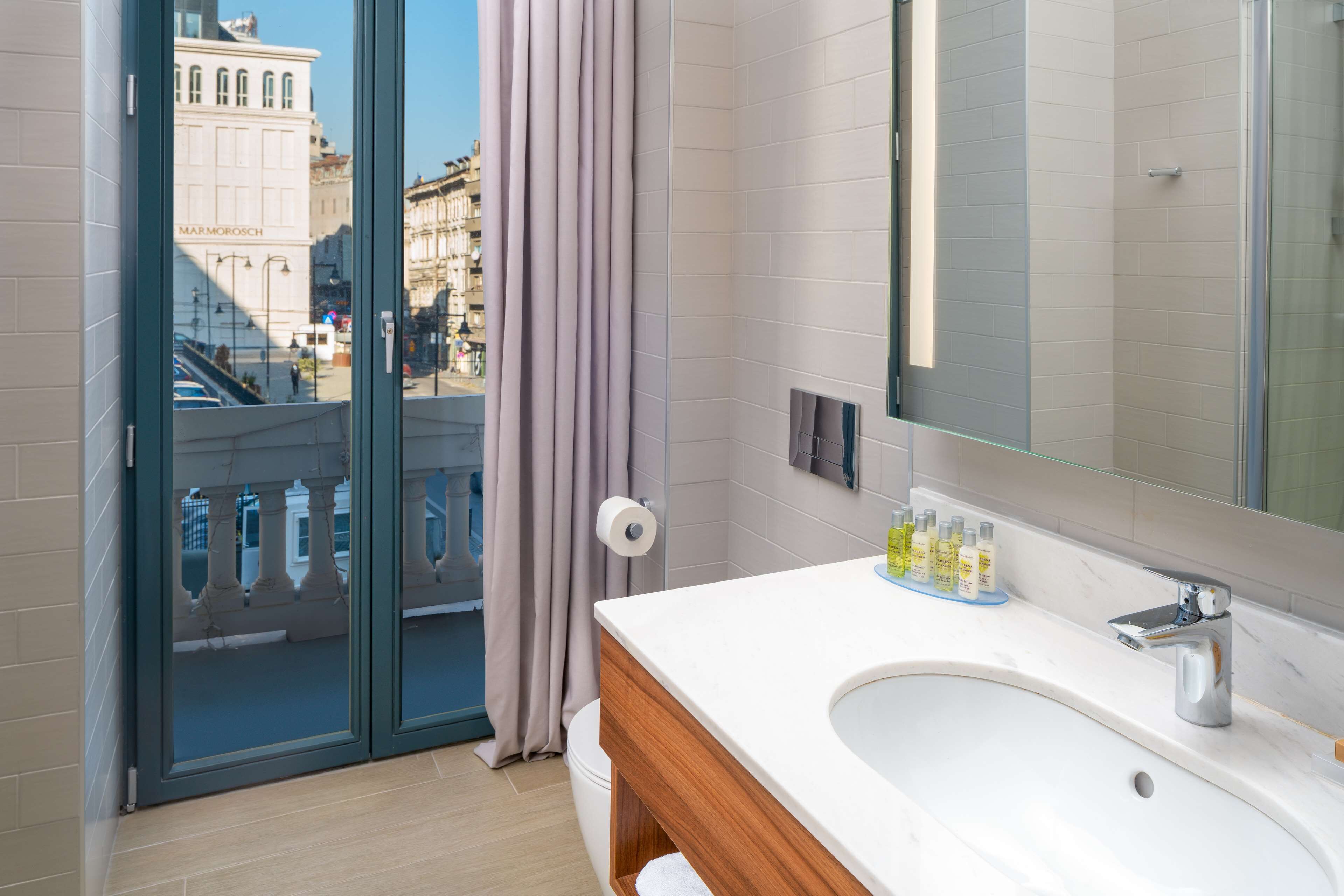 room, 1 king bed | bathroom | designer toiletries, hair dryer, towels