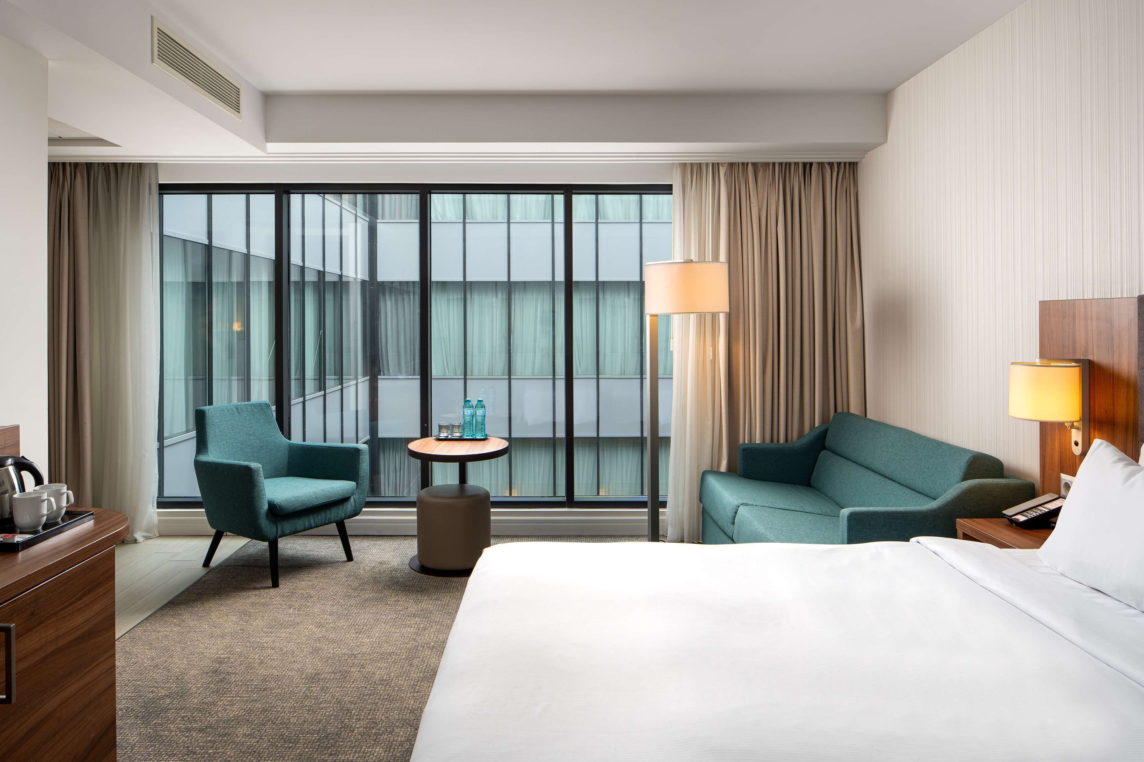 junior suite, 1 king bed | in-room safe, desk, laptop workspace, blackout curtains