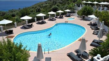 Outdoor pool, pool umbrellas, pool loungers