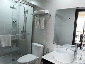 Shower, free toiletries, hair dryer, slippers
